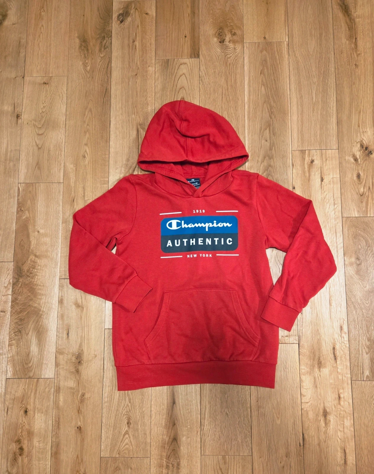 Sweat rouge à capuche 10 ans